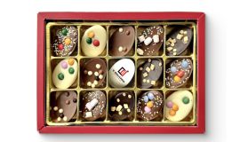 Gift box with decorated Easter eggs